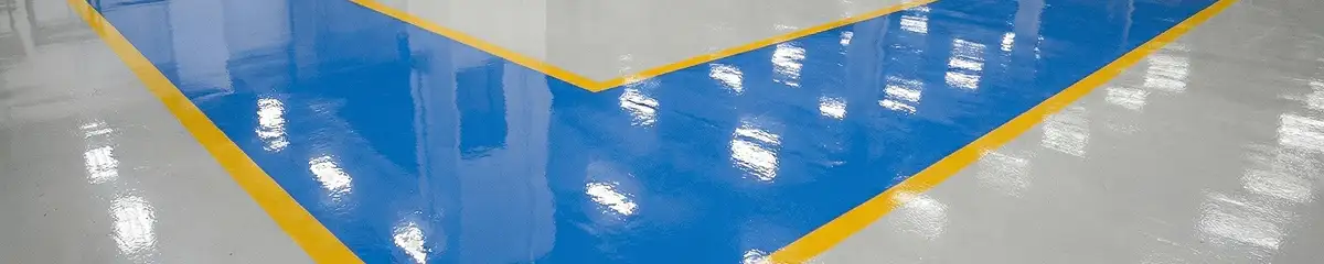 A factory floor professionally covered and marked with epoxy flooring in Des Moines, IA