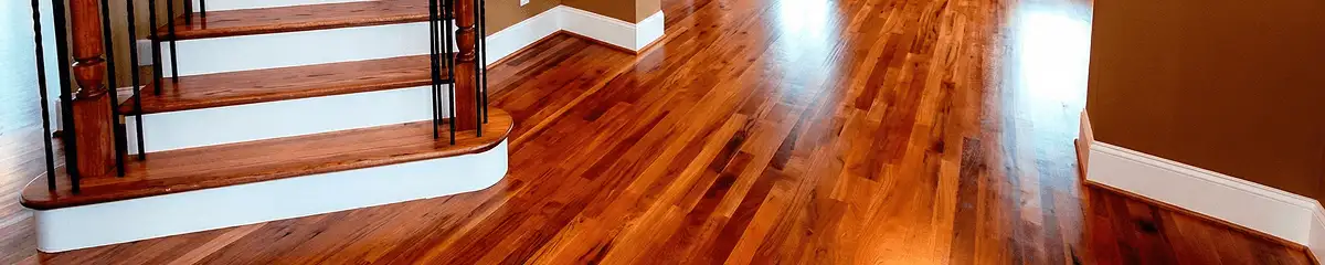 Base floor of a staircase with professionally restored wood flooring in Des Moines IA