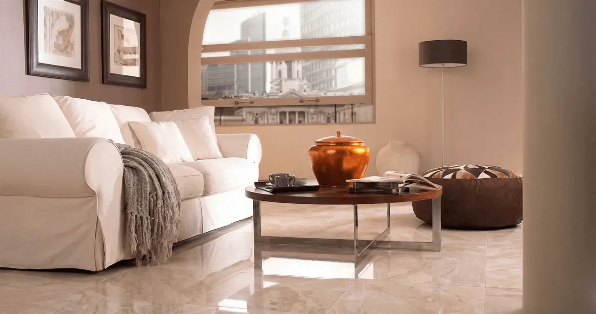 Modern living room with professionally installed marble flooring, a beige sofa, coffee table in Des Moines, IA