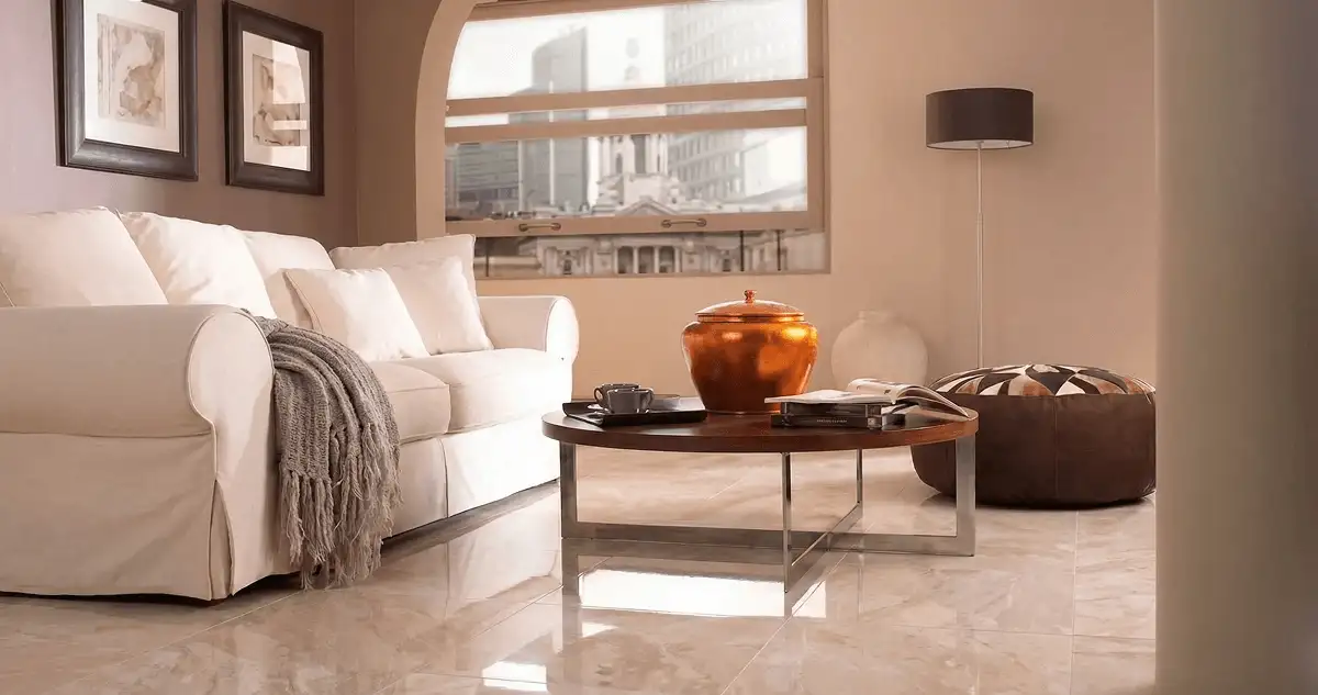 Modern living room with professionally installed marble flooring, a beige sofa, coffee table in Des Moines, IA