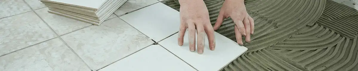 Professional installing white tile floors in Des Moines, IA