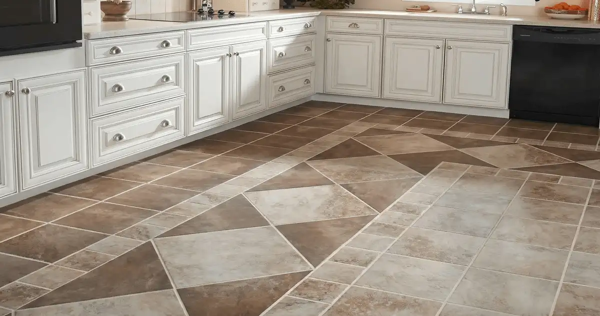 Kitchen with white cabinets and a professionally installed tile floor in Des Moines, IA