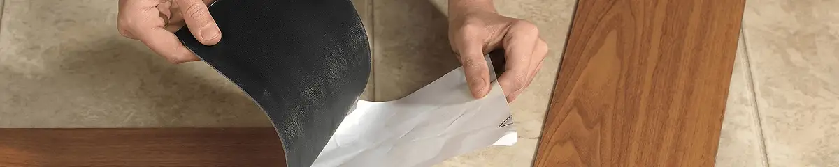 A professional installing vinyl flooring in Des Moines, IA